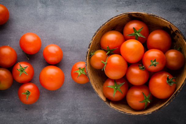 Tomato on the gray background. - Foto, imagen