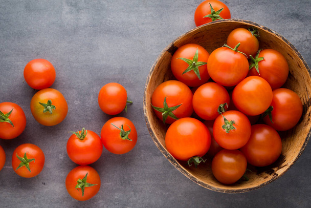 Tomato on the gray background. - Foto, Bild