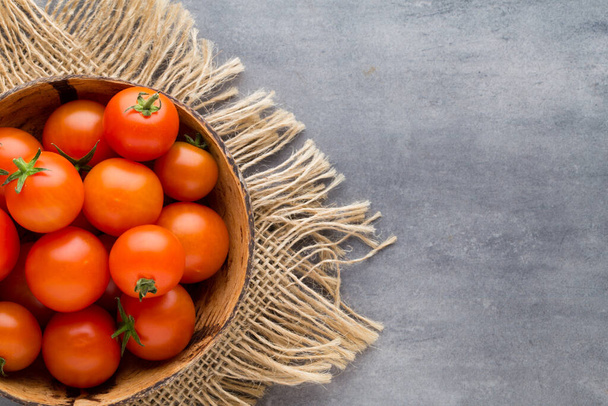 Tomato on the gray background. - Valokuva, kuva