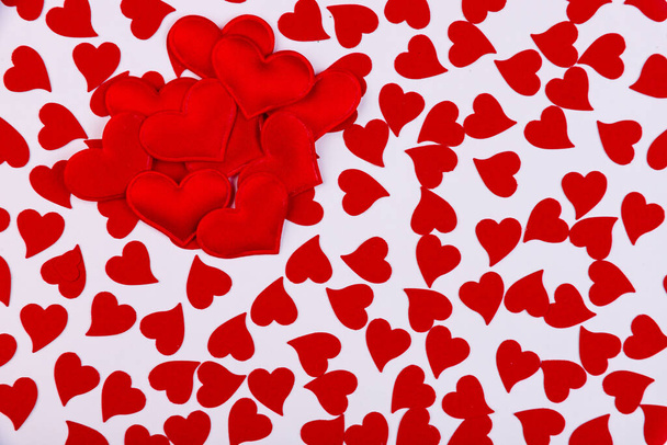 Background of small red hearts on a white background - Valokuva, kuva