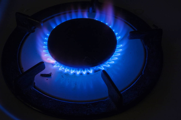 Blea gas flame from a stove in the dark - Photo, Image