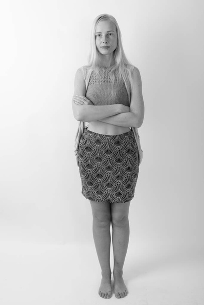Studio portrait of beautiful blond woman shot in black and white - Foto, imagen