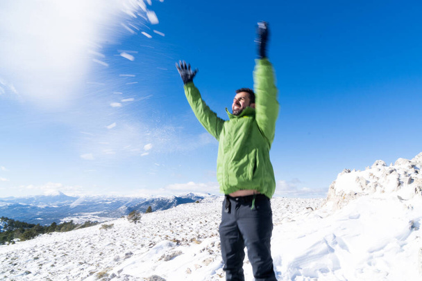 Young boy throwing snow - Foto, imagen