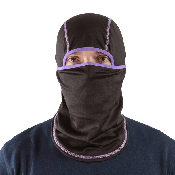 brunette man in a blue shirt with a black balaclava with purple edging - Foto, afbeelding