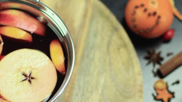 pan with mulled wine rotating on a wooden tray - Footage, Video