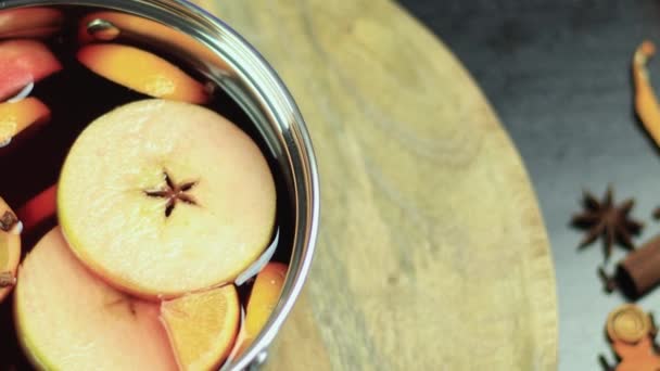 pan with mulled wine rotating on a wooden plate - Footage, Video