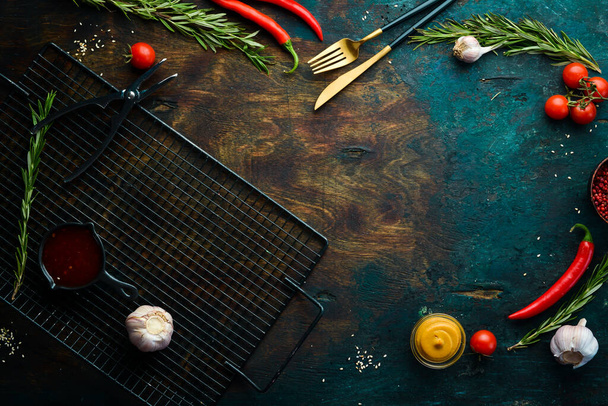 Banner. Background of food, spices and herbs on a dark stone table. Top view. Free space for text. - 写真・画像