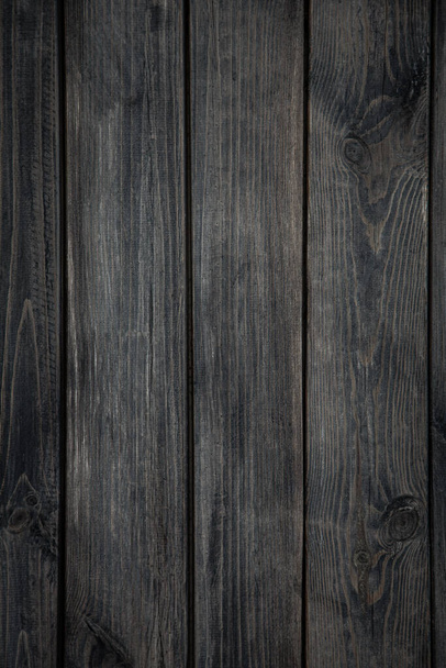 Medium brown wood texture background viewed from above. The wooden planks are stacked horizontally and have a worn look. - Foto, afbeelding