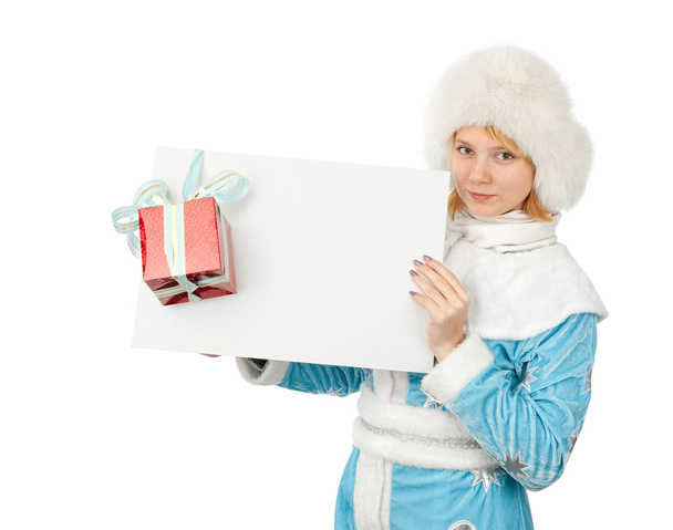 Christmas woman holding blank paper sheet - Фото, изображение