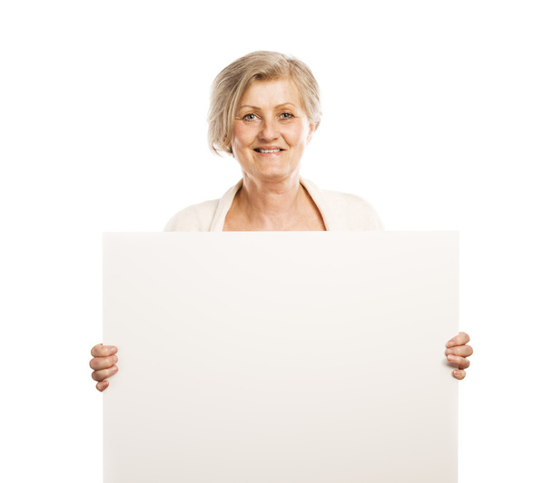 Senior woman with advertising board - Fotoğraf, Görsel