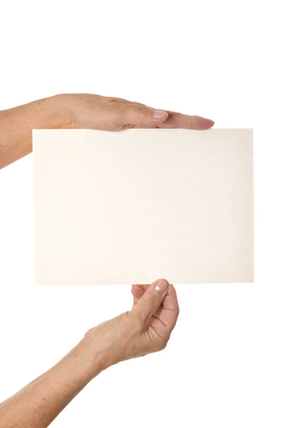 Hand holding blank paper - Foto, afbeelding