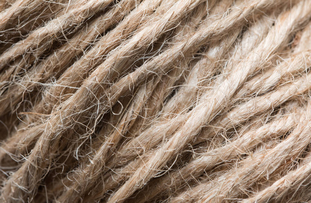 Close up background texture of brown twine wound on a reel. Natural hemp fibers used in production.  - Φωτογραφία, εικόνα