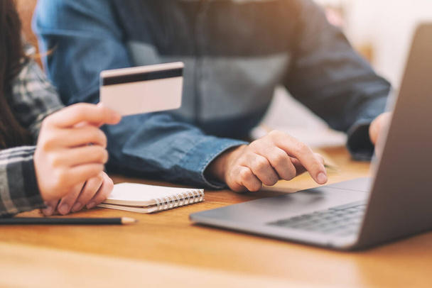 Businessman using credit card for purchasing and shopping online  - Фото, зображення