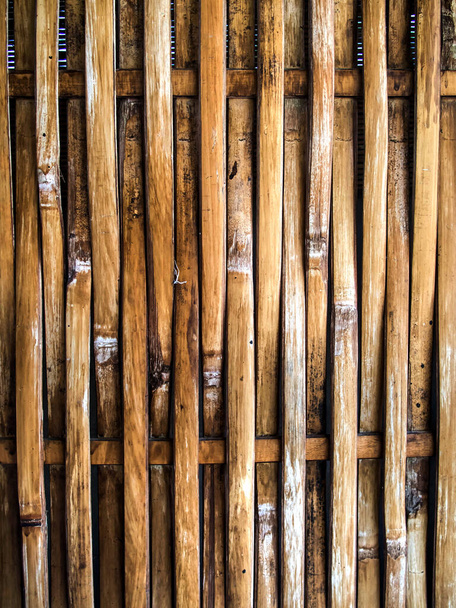 Closeup Image Of Bamboo Fence Tied With Ropes Stock Photo