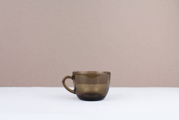 a brown glass coffee cup on background - Foto, Imagen
