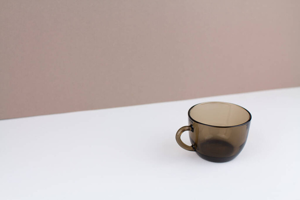 a brown glass coffee cup on background - 写真・画像