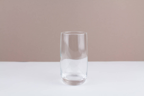 a glass cup on white brown background stylish in the kitchen - Zdjęcie, obraz