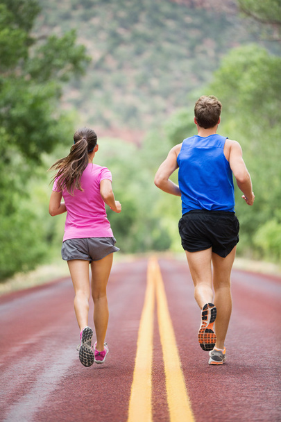 Running training runners jogging on road - Фото, изображение