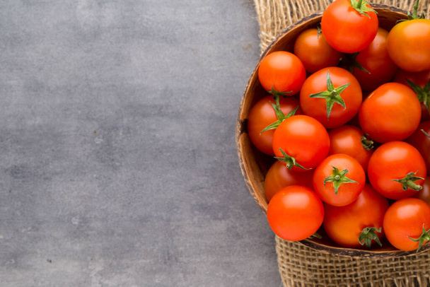 Tomato on the gray background. - Фото, зображення