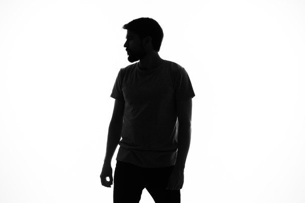 emotioneel man silhouet model wit achtergrond bijgesneden uitzicht - Foto, afbeelding