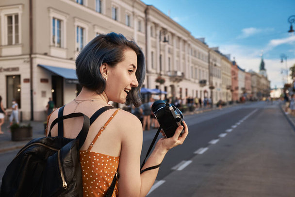 Female tourist shooting on the street, summer Eurotrip - Фото, зображення