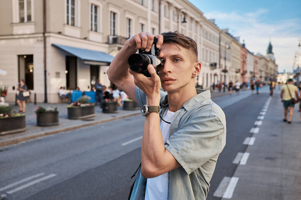Male tourist shooting on the street, summer Eurotrip - Photo, Image