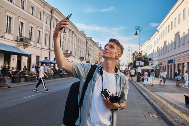 Male tourist shooting on the street, summer Eurotrip - Photo, Image