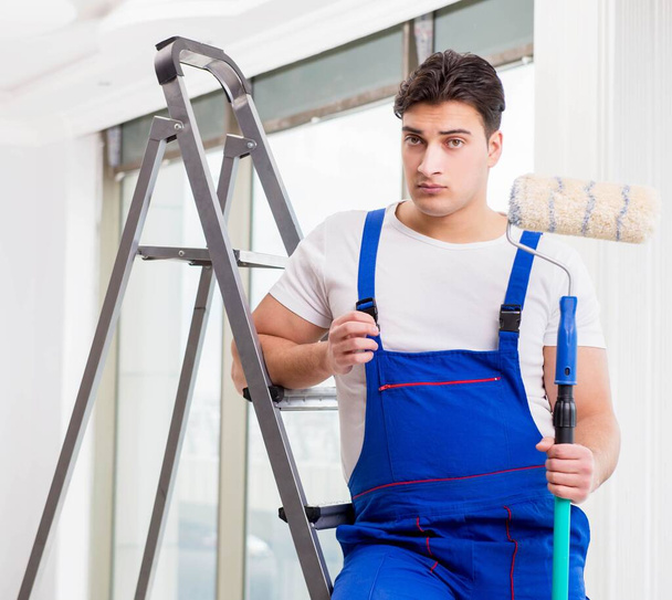 Painter repairman working at construction site - Fotografie, Obrázek