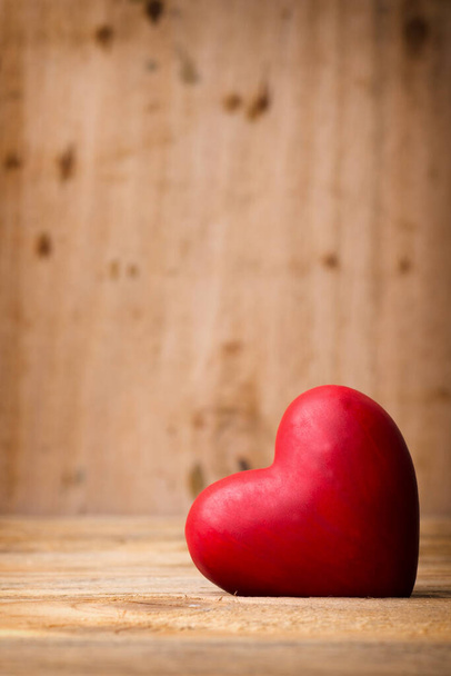 Red heart on the wooden  background. - Foto, Imagem
