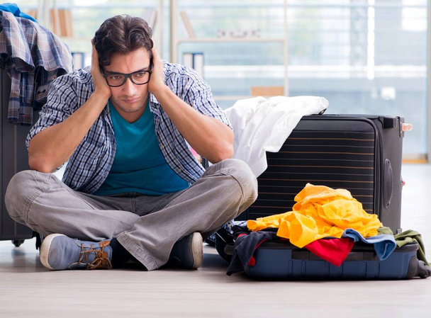 Young man preparing for vacation travel - Foto, imagen