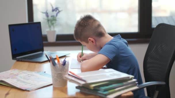 Back to School, Online learning, distance lesson, education at home, technology for schoolboy, business conference. Children doing homework at home on laptop - Footage, Video