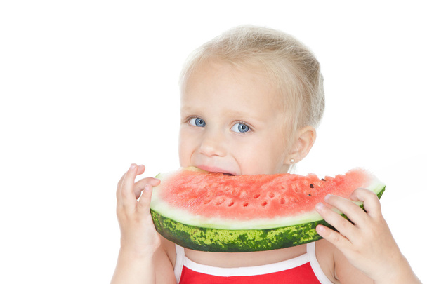 Little girl eating a watermelon - Фото, зображення