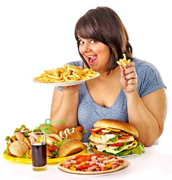 Woman eating fast food. - Photo, Image