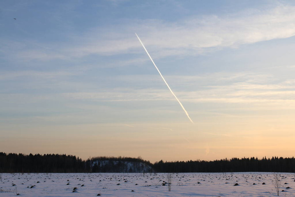 snow field, sunset, flying plane - Photo, Image