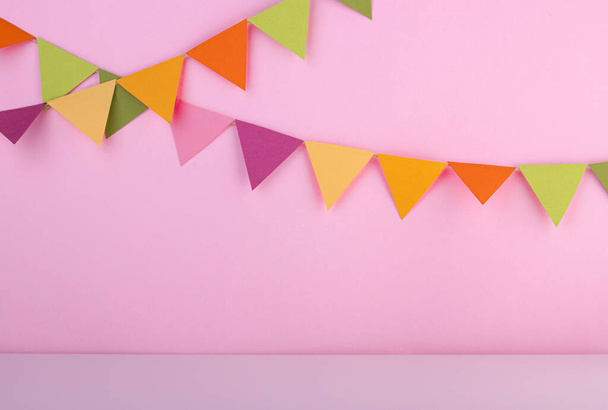 background for the birthday party with colorful flags. the concept of a birthday, festive background - Фото, изображение