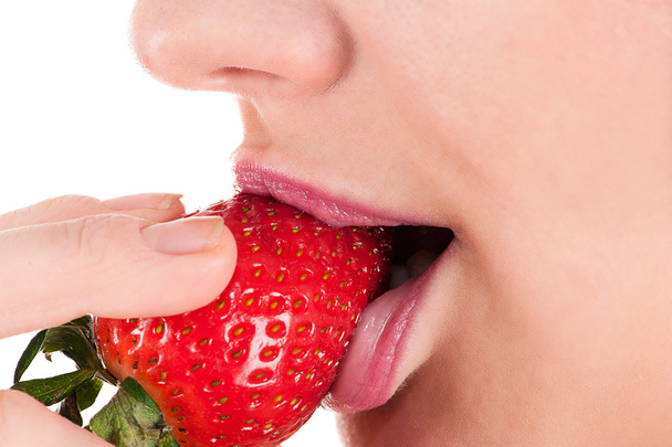 Woman eating strawberry - Photo, Image