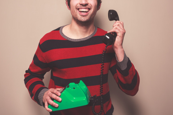 Happy young man on the telephone - Valokuva, kuva