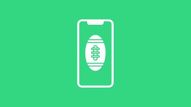 Witte Smartphone met Amerikaanse voetbal bal op het scherm pictogram geïsoleerd op groene achtergrond. Online voetbal spel voor mobiele telefoon. 4K Video motion grafische animatie - Video