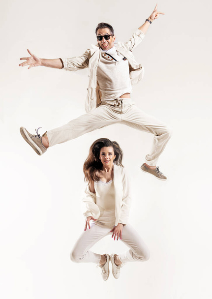 Talented couple dancing in a bright studio - isolated - Foto, imagen
