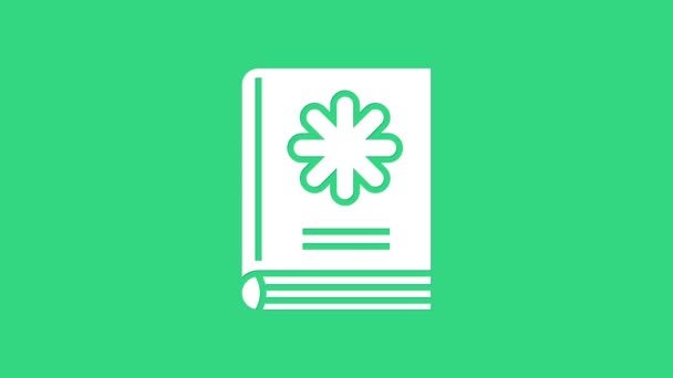 緑の背景に隔離された白い医学の本のアイコン。4Kビデオモーショングラフィックアニメーション - 映像、動画