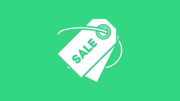 White Price tag met een inscriptie Sale icoon geïsoleerd op groene achtergrond. Badge voor de prijs. Promo tag korting. 4K Video motion grafische animatie - Video