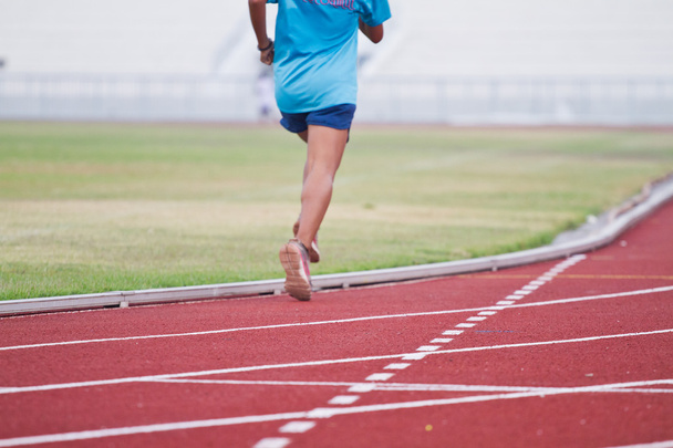 Cropped image of  runner on competitive running - Photo, Image