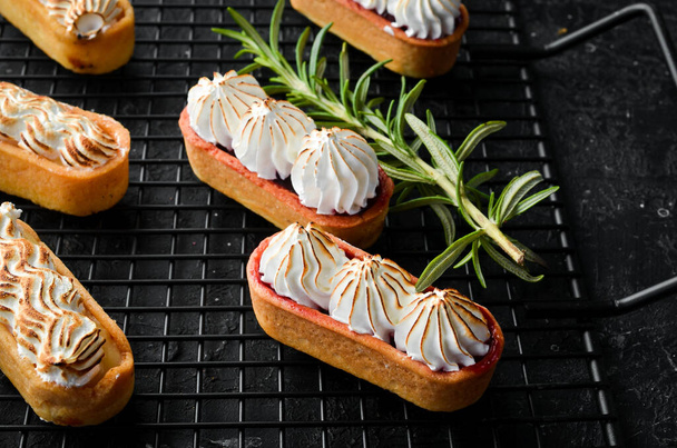Sweet mini tart with cherry jam and cream. Baking. Top view. Sweets. - Valokuva, kuva