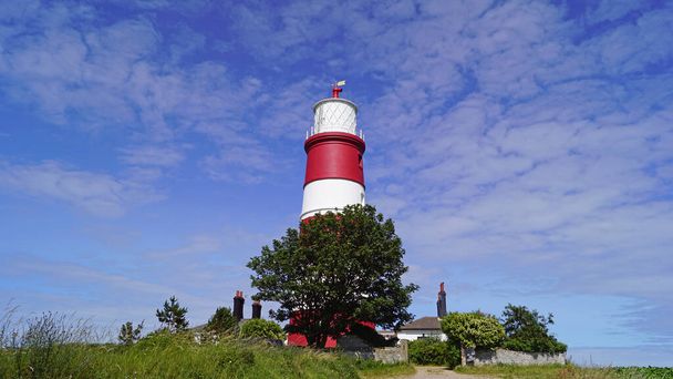 De Happisburgh Lighthouse aan de noordkust van Norfolk is de enige onafhankelijk geëxploiteerde vuurtoren in het Verenigd Koninkrijk en tevens de oudste werkende vuurtoren in East Anglia.. - Foto, afbeelding