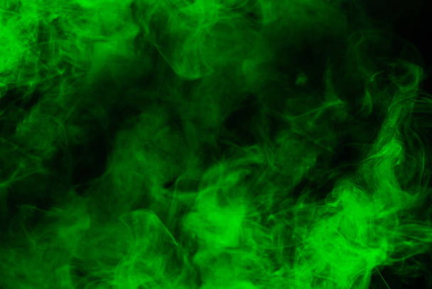Green steam on a black background. Copy space. - Foto, immagini