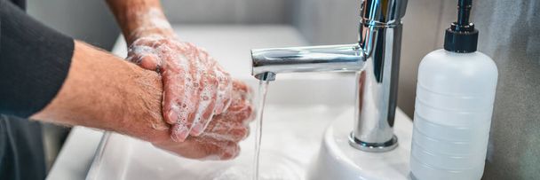 Corona virus travel prevention wash hands with soap and hot water. Hand hygiene for coronavirus outbreak. Protection by washing hands frequently concept panoramic banner header - Zdjęcie, obraz