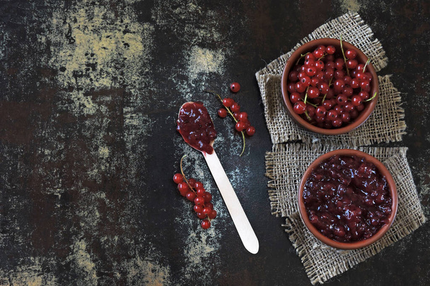 Homemade redcurrant jam. Fresh berries of red currant. Concept cooking jam. - Zdjęcie, obraz