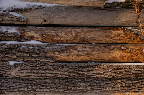 Old wooden background with falling snow flakes. Wooden background and snow - Foto, imagen