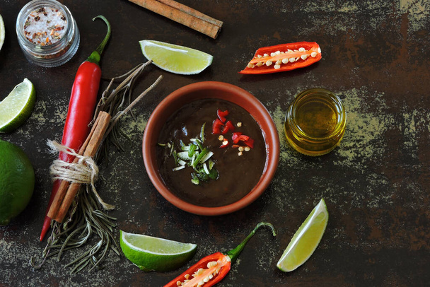 Spicy chili lime sauce and ingredients. Copy space. - Foto, afbeelding
