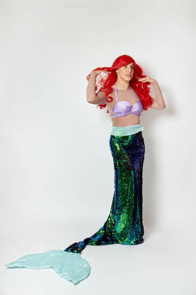 A woman in a full-length mermaid costume. Costume party or Halloween. - Zdjęcie, obraz